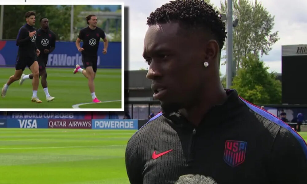 Male US Soccer player being interviewed on a training field, with an inset of three teammates jogging during practice behind him.