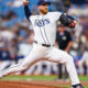 Tampa Bay Rays pitcher delivering a pitch on the mound during a game.