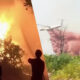 Silhouetted figures watch a large wildfire with intense flames on the left, and a helicopter near smoke on the right.