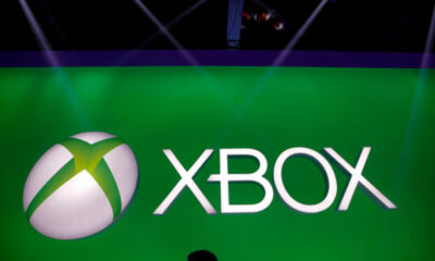 Xbox brand logo on a bright green backdrop, with a white and green spherical emblem adjacent to the word 'XBOX'