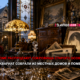 Interior of a cluttered antique-filled parlor with wooden furniture, portraits, and glassware; banner headline about selling old manor treasures.