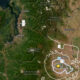 Map showing an earthquake epicenter near Yakima with concentric hazard rings and surrounding cities like Olympia and Kennewick.