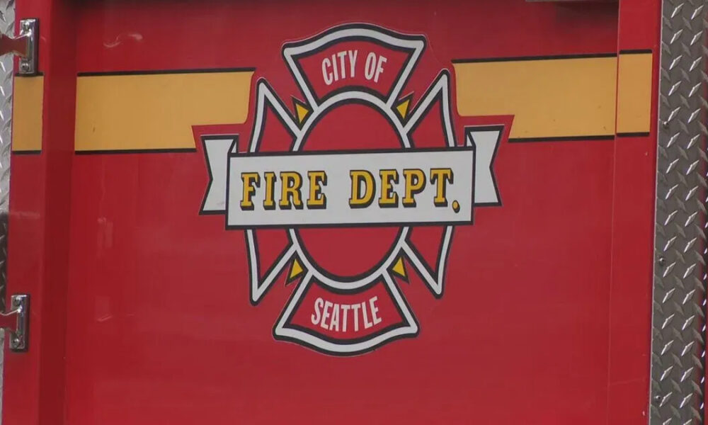 Seattle Fire Department emblem on a red fire truck door.