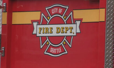 Seattle Fire Department emblem on a red fire truck door.