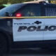 Tukwila Police Department SUV parked with yellow police tape in front, crime scene setting.