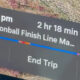 Navigation card showing trip progress: time, duration, distance, and a progress bar with End Trip option.